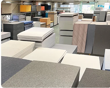 Prepared acoustic panel sheets in a workshop